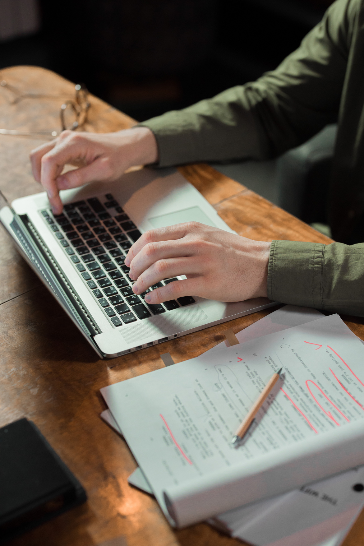 Person Typing on Laptop